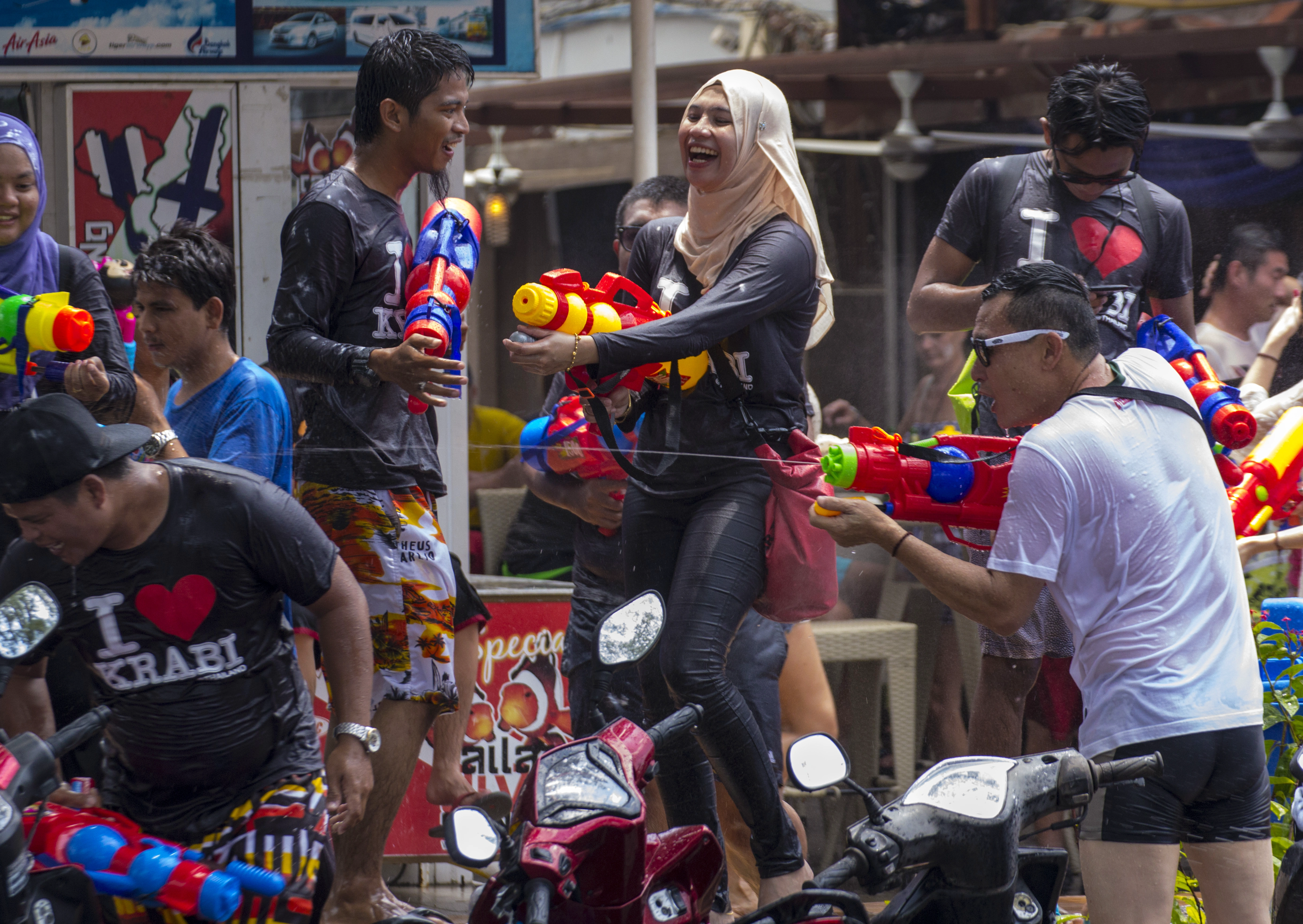 People spray each other with water during Songkran festival in Thailand